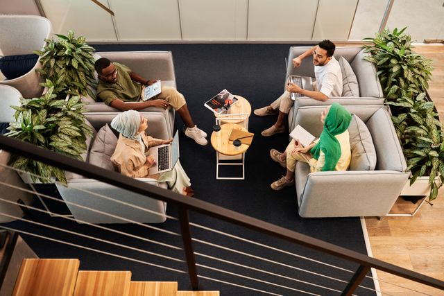 a group of people sitting in a common area